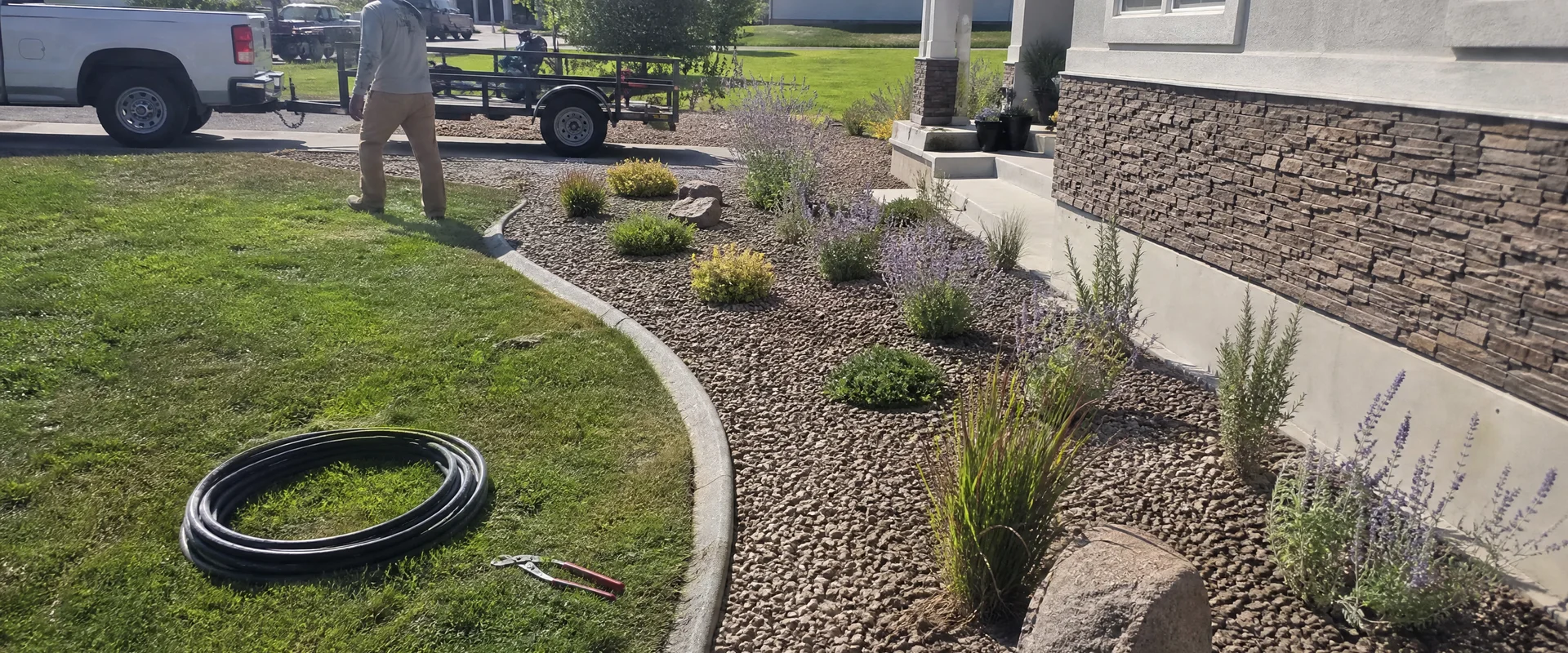 YLC Landscaping crew completing drip irrigation installation on a Utah property