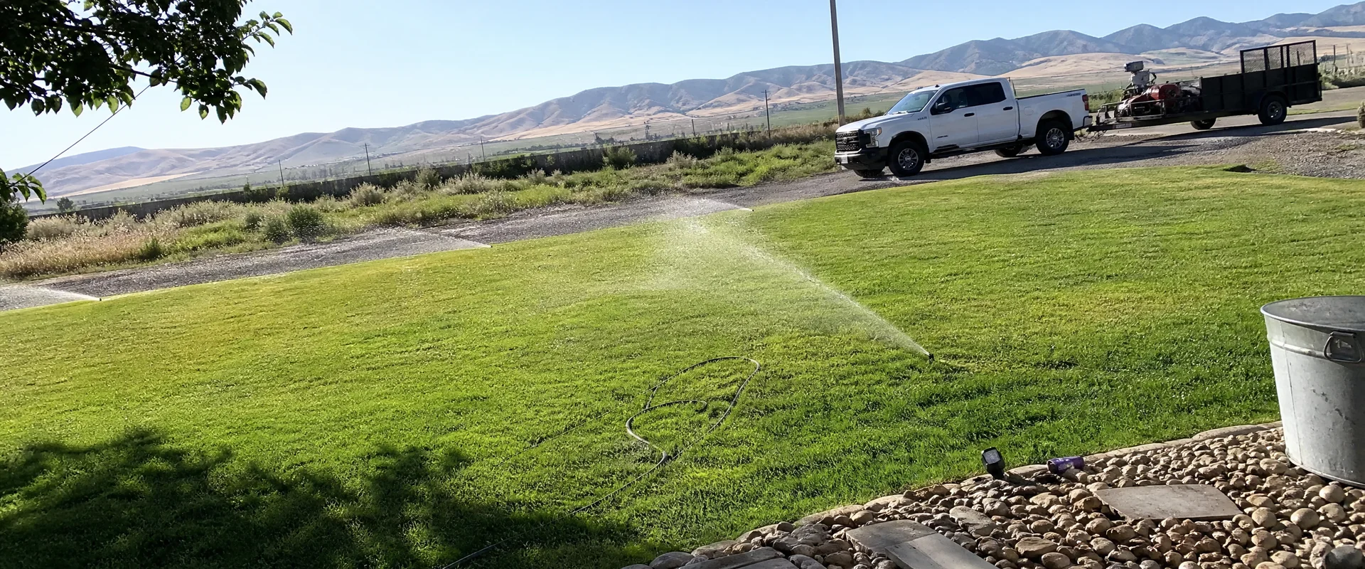 YLC Landscaping crew completing sprinkler system installation & repair on a Utah property