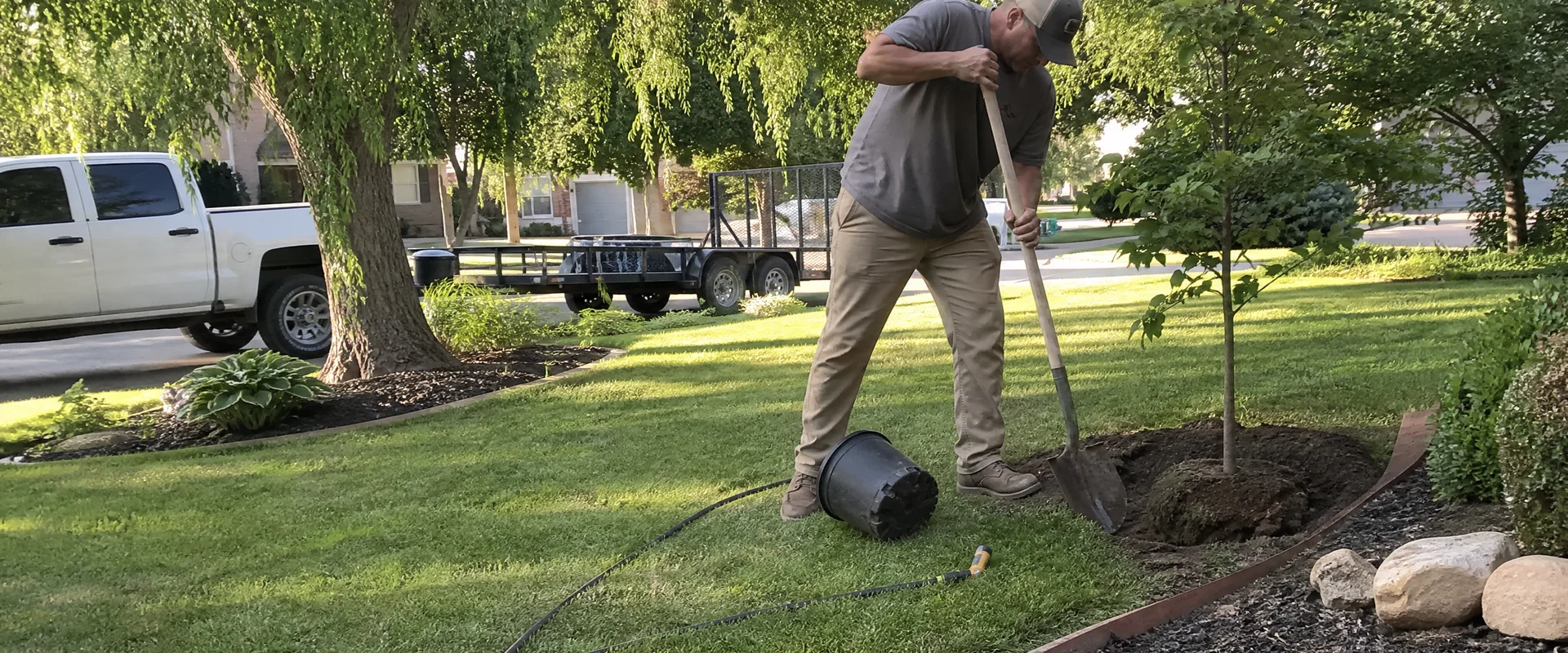 YLC Landscaping crew completing tree & plant installation on a Utah property